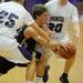 Dexter senior Jay Lewis attempts to pass the ball around Pioneer senior Grant Schaefer and senior Jimmy Holman during the second half against Pioneer during a district match up at Pioneer on Wednesday. Melanie Maxwell I AnnArbor.com